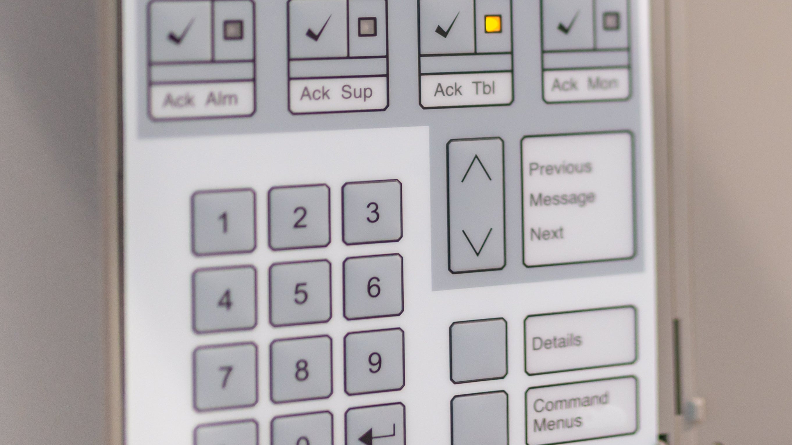 Control panel with digital display and buttons on a machine